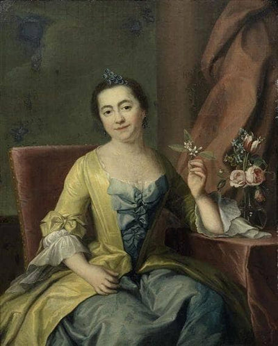 Portrait of a lady, three-quarter-length, in a blue dress, seated, holding a flower in dining room