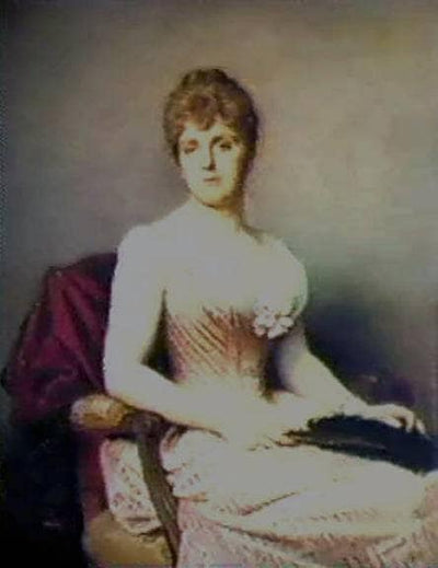 A young woman holding a feather in master bedroom