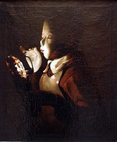 Boy Blowing at Lamp in hallway