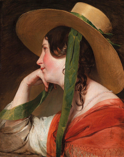 Girl with straw hat in kitchen