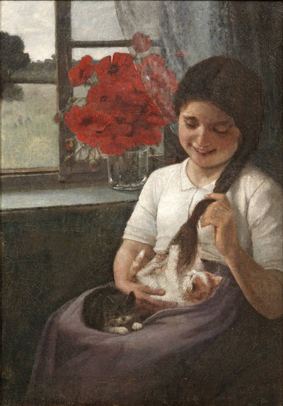 Girl in the playing with two kittens in apartment