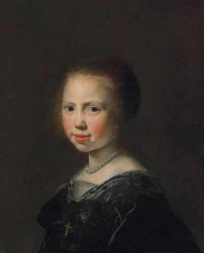 Portrait of a girl, bust-length, in a black dress and pearl necklace in living room
