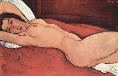 Reclining nude with folded arms behind her head in modern living room