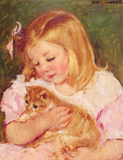 Sara Holding A Cat in kitchen