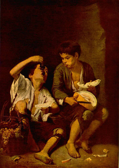Two Boys Eating a Melon and Grapes in kitchen
