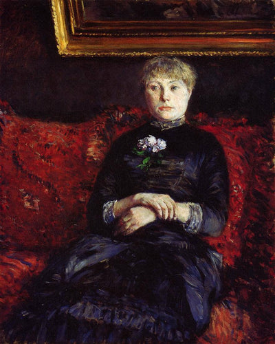 Woman Sitting on a Red Flowered Sofa in modern living room