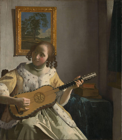 Youg woman playing a guitar in dining room