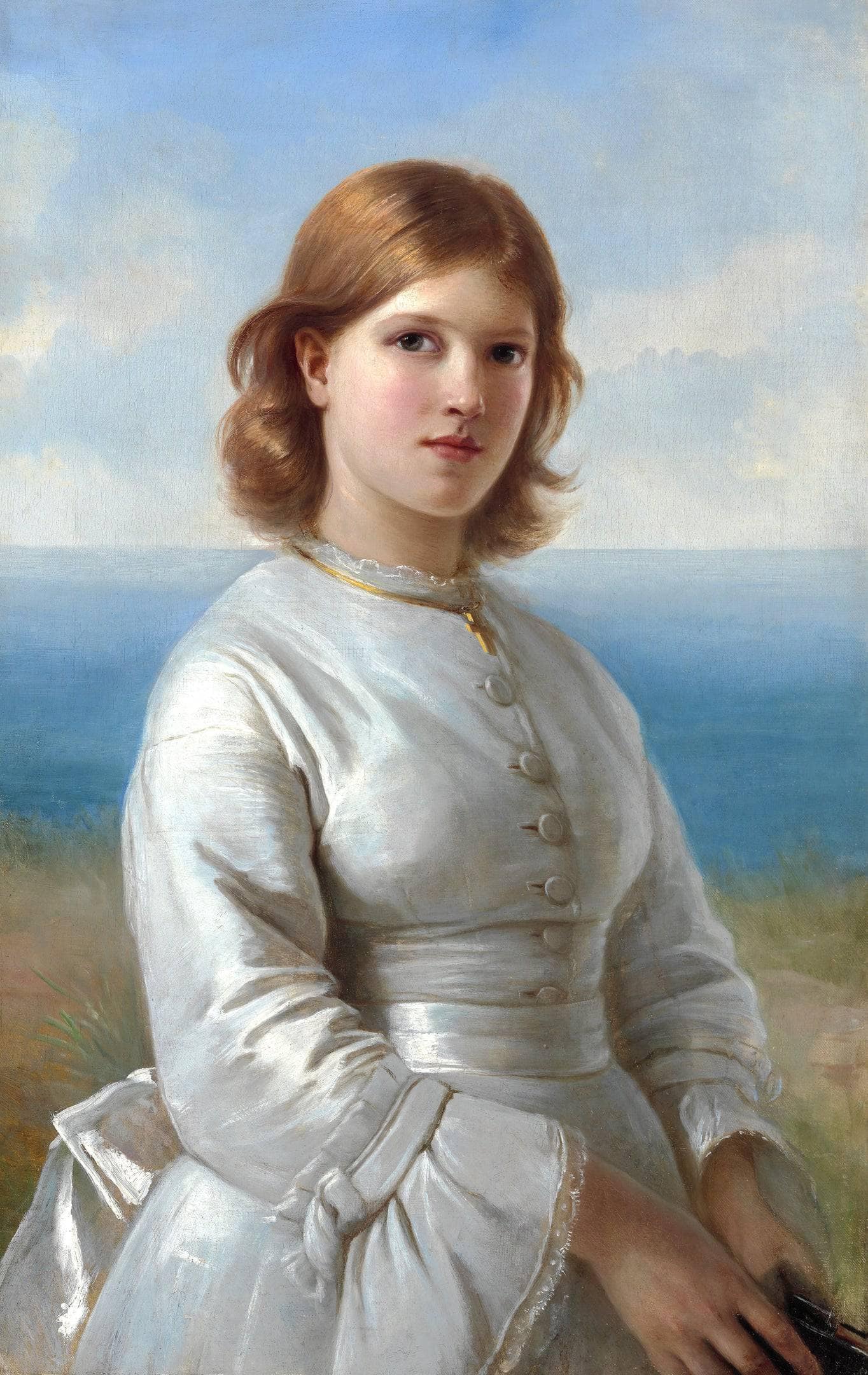 A young communiant girl in a white silk dress, a gold cross around his neck and a hymn book in his hand