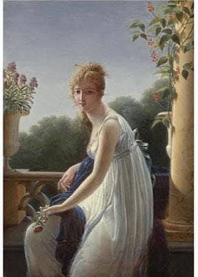 A young woman seated by a window