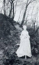 An elegant lady walking on a woodland path by Karl Gussow — forest oil painting wall art, Realism