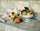 Apples and pears on white in apartment