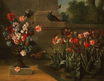 Bed of tulips and vase of flowers at the foot of a wall in hallway