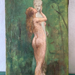 Nude woman kissing a statue