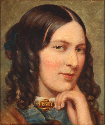 An Italian woman with a gold brooch in home office