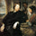 George Gage with Two Men in living room