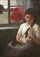 Girl in the playing with two kittens in hallway