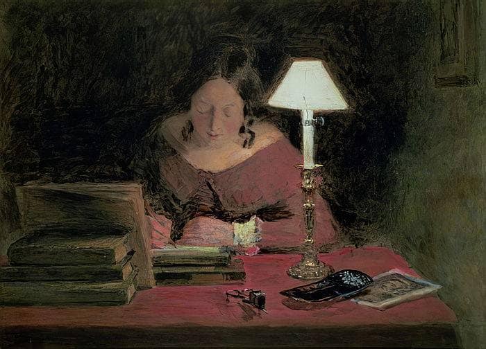 Girl writing by lamplight