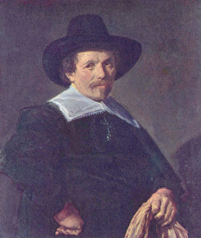 Portrait of a Man holding Gloves in modern living room