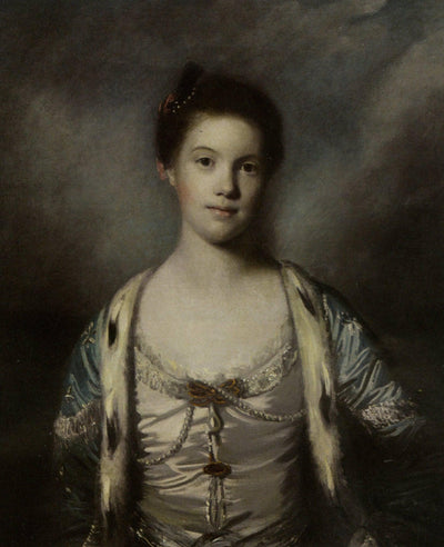 Portrait of Bridget Moris in a White Silk Dress in home office