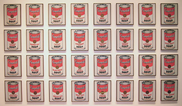 Campbell's Soup Cans by Andy Warhol, the thirty-two canvases hung in four rows of eight on a white gallery wall at the Museum of Modern Art.