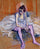 Seated Dancer in Pink Tights in living room