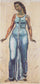 Standing female figure in a blue dress in kitchen