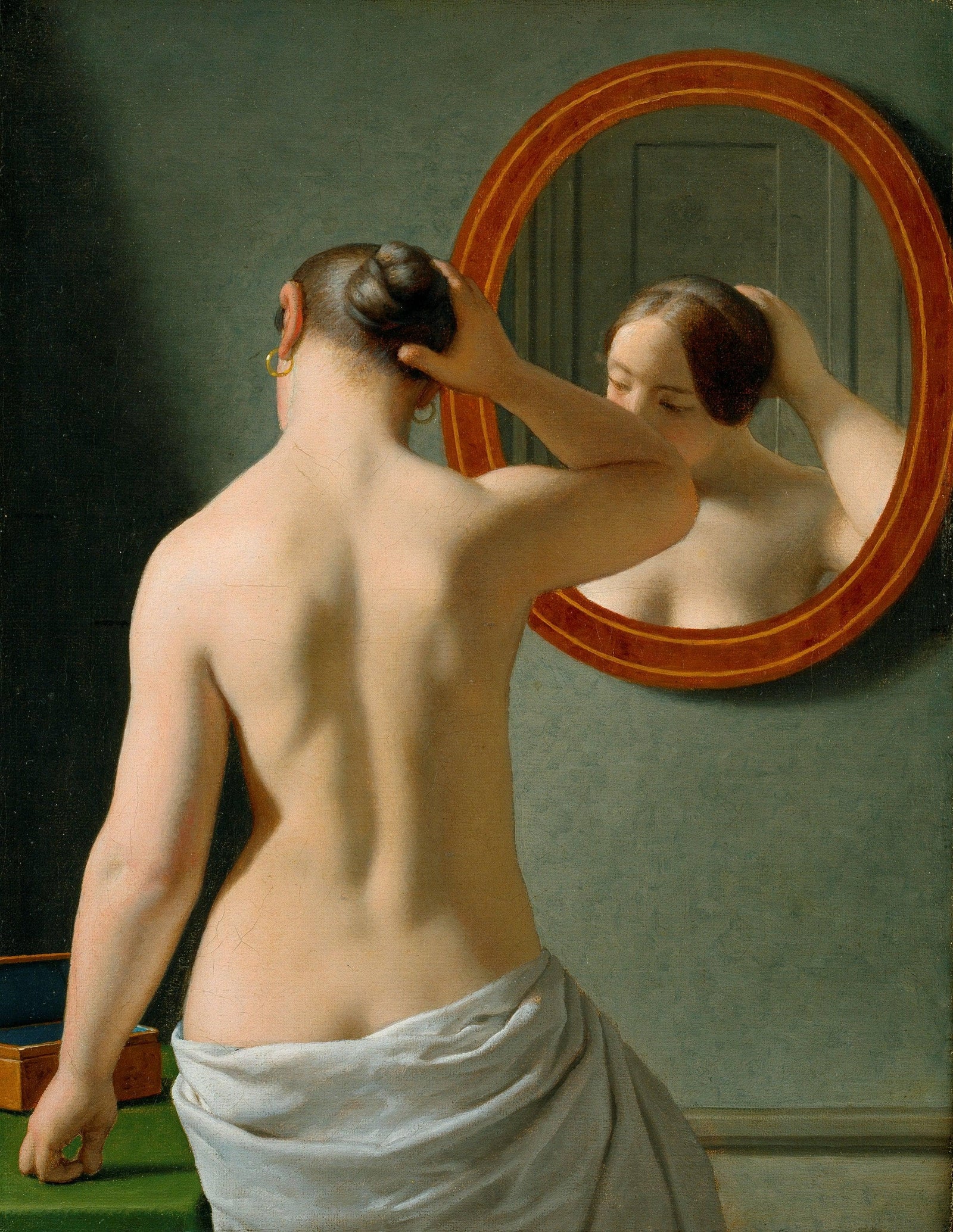 Woman Standing in Front of a Mirror or Morning Toilette