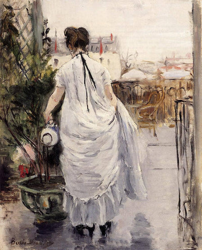 Young Woman Watering a Shrub in entryway