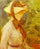 Young Woman with a Straw Hat in kitchen